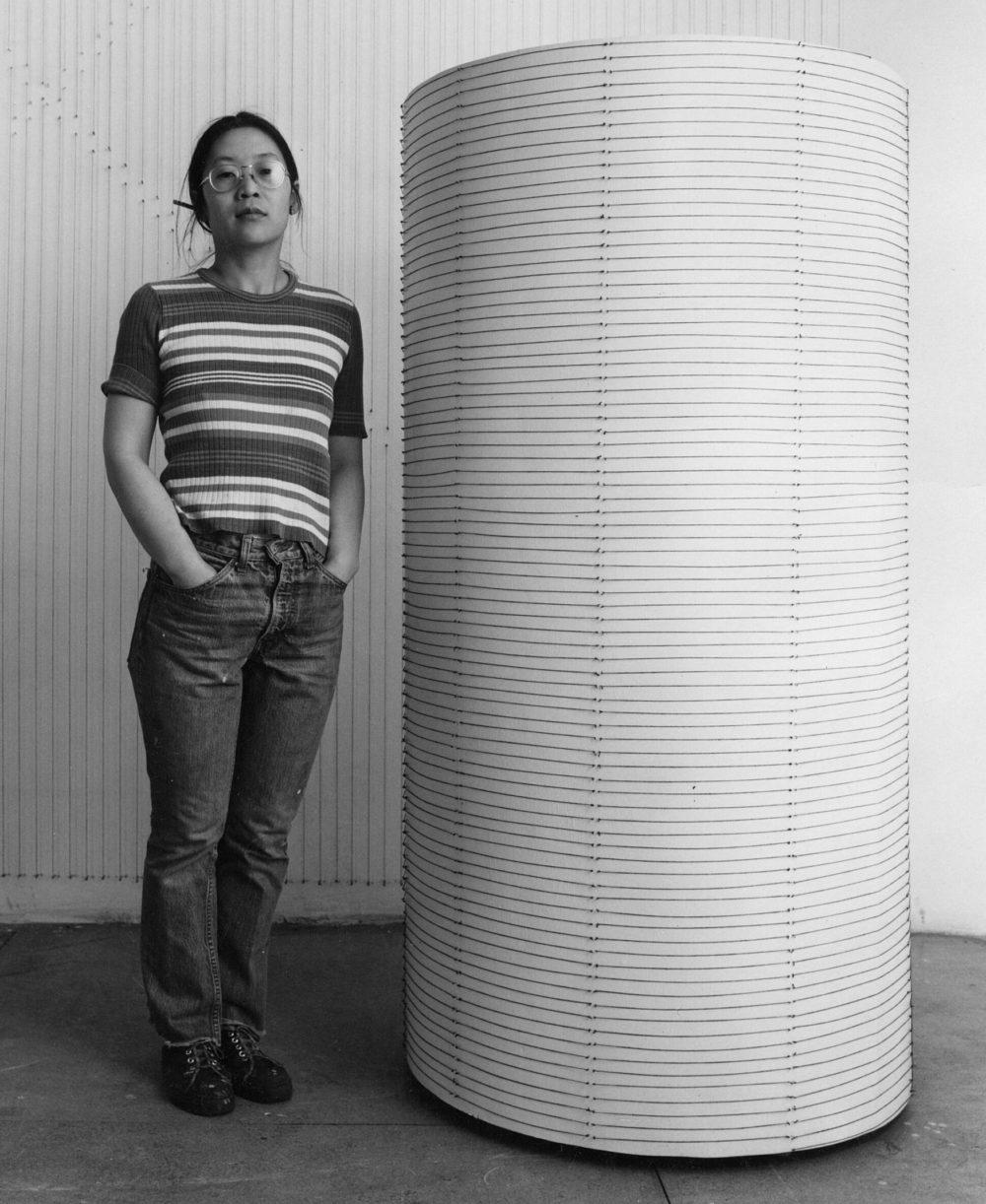 Kazuko Miyamoto standing by String around a cylinder of my height, 1977 Kazuko Miyamoto standing by String around a cylinder of my height, 1977